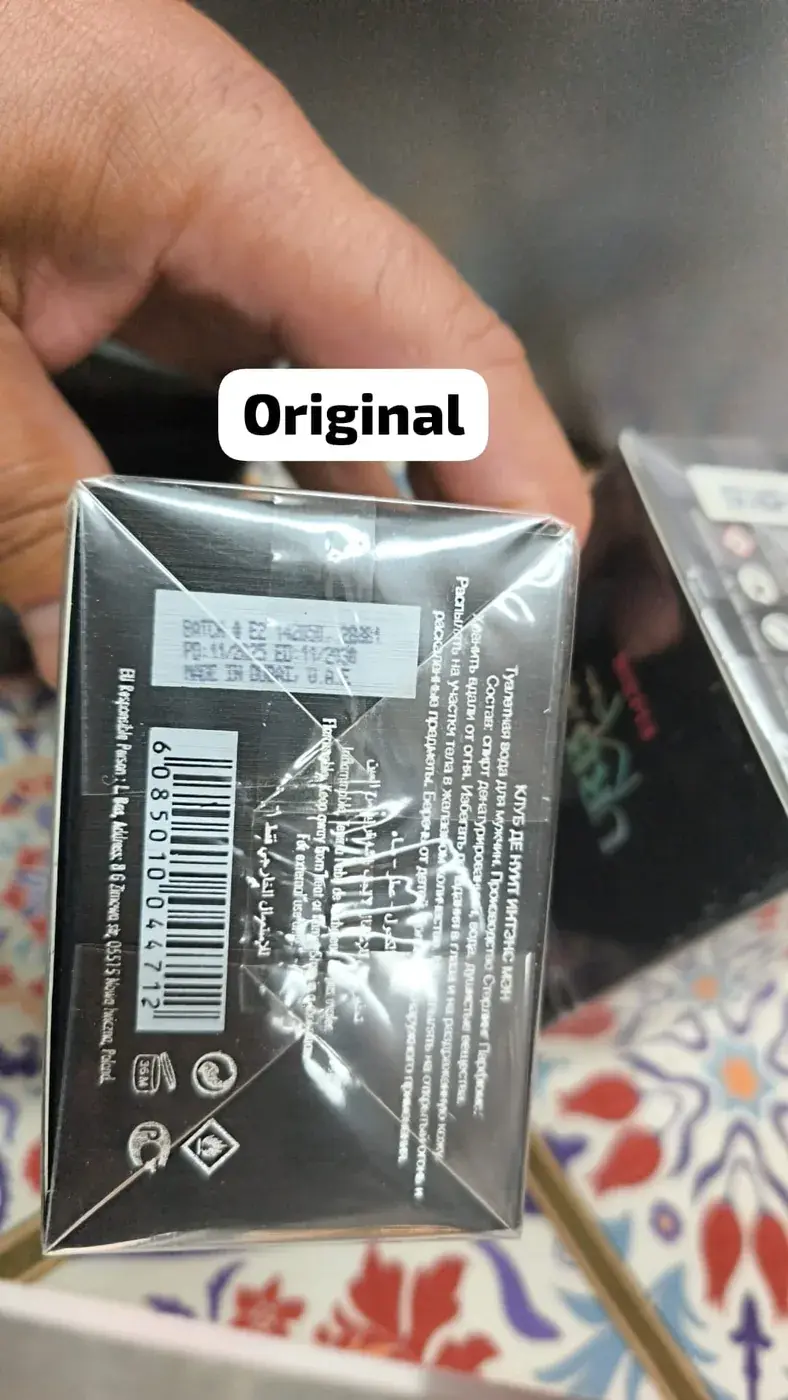 Base de la caja de un Club de Nuit Intense Man con etiqueta de lote, EAN y símbolos, señalado como original